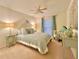 Bedroom with light blue bedding and ceiling fan at 2353 Kilgore Dr, Largo, FL 33770