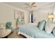 Bedroom with light blue bedding and ceiling fan at 2353 Kilgore Dr, Largo, FL 33770