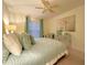 Spacious bedroom with ceiling fan and light blue bedding at 2353 Kilgore Dr, Largo, FL 33770