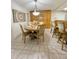 Bright dining area with light wood table and chairs at 2353 Kilgore Dr, Largo, FL 33770