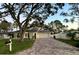 Charming single story home with a paved driveway and mature landscaping at 2353 Kilgore Dr, Largo, FL 33770