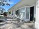 House exterior showcasing a covered entryway and stone pathway at 2353 Kilgore Dr, Largo, FL 33770