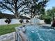 Relaxing hot tub in backyard with a shed and privacy fence at 2353 Kilgore Dr, Largo, FL 33770