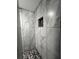 Modern shower with pebble floor and sleek tile at 2353 Kilgore Dr, Largo, FL 33770