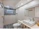 Clean bathroom with modern vanity, shower, and mosaic tile at 4380 44Th S St, St Petersburg, FL 33711