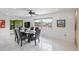 Bright dining room with glass table and seating for six at 4380 44Th S St, St Petersburg, FL 33711