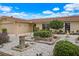 Landscaped front yard with a fountain and tranquil zen garden at 4380 44Th S St, St Petersburg, FL 33711