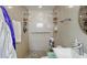 Walk-in shower with tiled flooring and multiple shower heads at 4380 44Th S St, St Petersburg, FL 33711