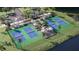 Four pickleball courts with ample parking and lush landscaping at 12589 Lily Quartz Loop, Parrish, FL 34219