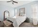 Serene bedroom featuring light blue walls and ample natural light at 3407 Fox Squirrel Ln, Valrico, FL 33594