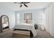 Light and airy bedroom with a ceiling fan and large windows at 3407 Fox Squirrel Ln, Valrico, FL 33594