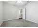 Simple bedroom with grey walls and carpeted floor at 3407 Fox Squirrel Ln, Valrico, FL 33594