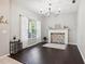 Charming dining room featuring a decorative fireplace and hardwood floors at 3407 Fox Squirrel Ln, Valrico, FL 33594