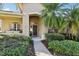 Inviting front entrance with a porch and lush landscaping at 3407 Fox Squirrel Ln, Valrico, FL 33594