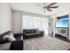 Spacious living room with dark hardwood floors and a ceiling fan at 3407 Fox Squirrel Ln, Valrico, FL 33594