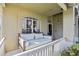 Relaxing front porch swing perfect for enjoying the outdoors at 3407 Fox Squirrel Ln, Valrico, FL 33594