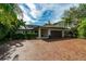 Home exterior showcasing modern design, brick paver driveway, and attached garage at 1331 Brightwaters Ne Blvd, St Petersburg, FL 33704