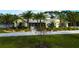 Aerial view of a two-story house with a large yard at 2420 Kent Pl, Clearwater, FL 33764