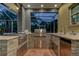 Luxury outdoor kitchen with stainless steel appliances and stone countertops at 2420 Kent Pl, Clearwater, FL 33764