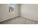 Simple bedroom with carpeted floor and a window at 6092 Timberdale Ave, Wesley Chapel, FL 33545