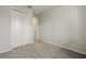 Simple bedroom with carpet flooring and double door closet at 6092 Timberdale Ave, Wesley Chapel, FL 33545