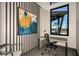 Modern workspace with a view of the pool and palm trees at 6092 Timberdale Ave, Wesley Chapel, FL 33545