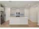 Spacious island kitchen with white countertops and gray cabinets at 6092 Timberdale Ave, Wesley Chapel, FL 33545