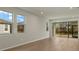 Living room with sliding glass doors leading to a patio at 6092 Timberdale Ave, Wesley Chapel, FL 33545