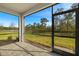 Spacious screened patio with paver floor and tranquil preserve views at 6092 Timberdale Ave, Wesley Chapel, FL 33545