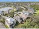 Aerial view of a house with solar panels and a neighborhood at 6232 French Creek Ct, Ellenton, FL 34222