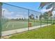 Green community basketball court with chain-link fence at 6232 French Creek Ct, Ellenton, FL 34222