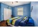 Blue bedroom with wood floors and plenty of closet space at 6232 French Creek Ct, Ellenton, FL 34222