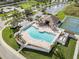 Aerial view of community pool, clubhouse, and tennis courts at 6232 French Creek Ct, Ellenton, FL 34222