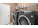 Laundry room with washer, dryer, and shelving at 6232 French Creek Ct, Ellenton, FL 34222