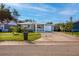 Cute ranch-style home with gray exterior and a spacious driveway at 6382 81St N Ave, Pinellas Park, FL 33781