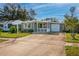 Single story home with gray exterior, white trim, and a 1-car garage at 6382 81St N Ave, Pinellas Park, FL 33781