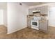 Updated kitchen featuring white appliances and gray cabinets at 6382 81St N Ave, Pinellas Park, FL 33781