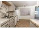 Clean kitchen featuring white appliances, modern backsplash and plentiful natural light at 6382 81St N Ave, Pinellas Park, FL 33781