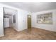 Bright living room featuring large windows and gray kitchen in background at 6382 81St N Ave, Pinellas Park, FL 33781