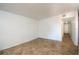 Minimalist living room featuring neutral walls and flooring with hallway entrance at 6382 81St N Ave, Pinellas Park, FL 33781