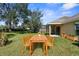 Enjoy outdoor dining on the patio overlooking a spacious backyard at 11136 Ancient Futures Dr, Tampa, FL 33647