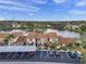 Aerial view showcasing condo community by a lake at 3840 Staysail Ln # 3840, Holiday, FL 34691