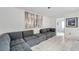 Spacious living room with sectional sofa and access to other rooms at 3840 Staysail Ln # 3840, Holiday, FL 34691