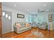 Bright living room featuring hardwood floors and comfy seating at 4302 W Obispo St, Tampa, FL 33629