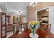 Dining area with a wood table, chairs, and a view into the kitchen at 460 48Th S St, St Petersburg, FL 33711