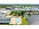 Aerial view of community with pool, lake, and buildings at 5875 21St N St # 15L, St Petersburg, FL 33714