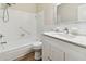 Clean bathroom with white tile, quartz vanity, and modern fixtures at 5875 21St N St # 15L, St Petersburg, FL 33714