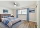 Main bedroom with a cozy atmosphere, neutral tones and hardwood flooring at 5875 21St N St # 15L, St Petersburg, FL 33714