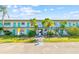 Condominium building exterior with teal accents and landscaping at 5875 21St N St # 15L, St Petersburg, FL 33714