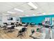 Community room with tables, chairs, and a large screen TV at 5875 21St N St # 15L, St Petersburg, FL 33714